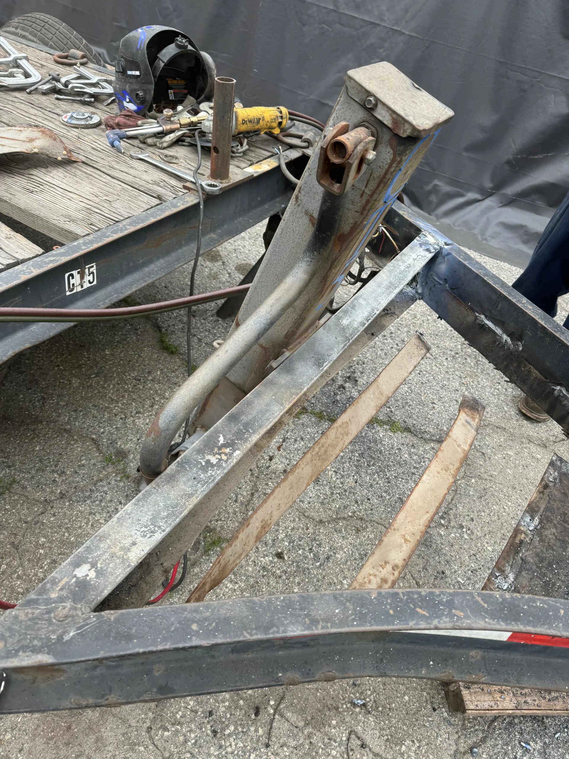 Trailer frame rails and crossmembers stripped down for structural welding repair