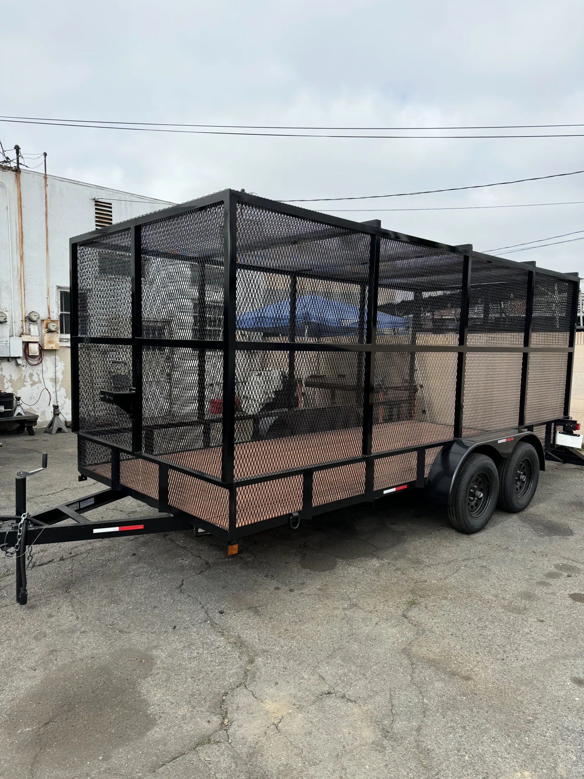 Tandem axle landscaping trailer with custom welded mesh cage sides built by A&R 1 Stop Shop