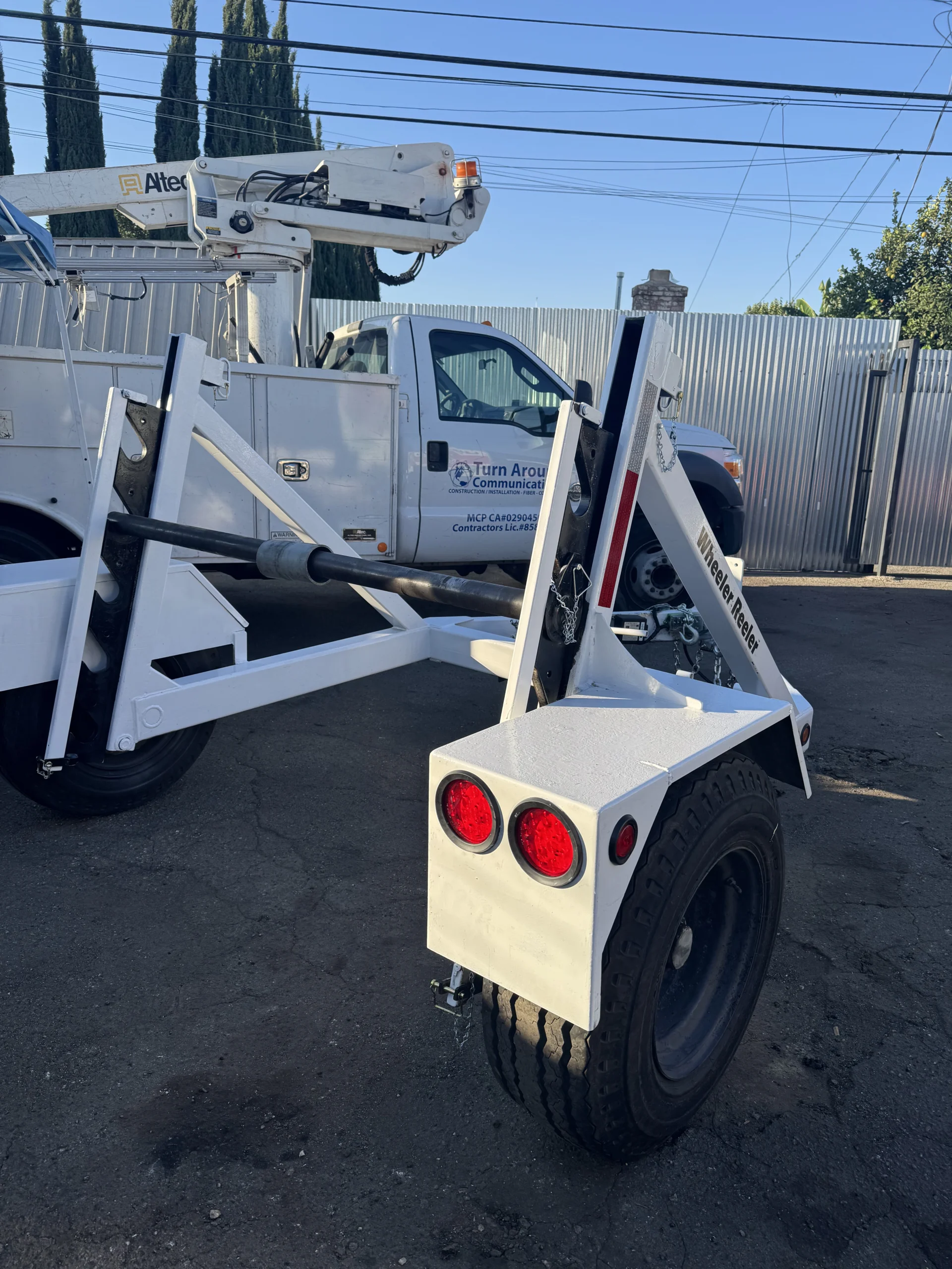 Fully restored white cable reel trailer with new lights after restoration by A&R 1 Stop Shop